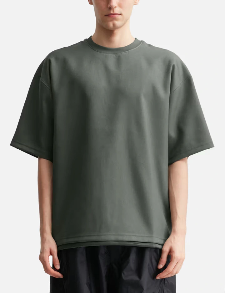 Camiseta técnica de poliéster gris de 170 g/m² para hombre con dobladillo ajustable y revestimiento impermeable. 1
